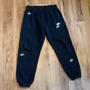 Nike (men but worn by a women) Black Joggers with Neon Swoosh Logos